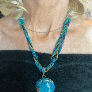 A beautiful peacock adorned necklace costume jewelry.
